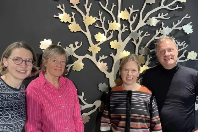 The research group in front of the Faculty of Medicine's donation tree.